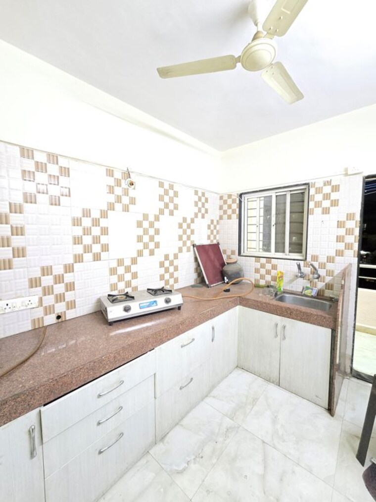 Kitchen, wadgaon sheri 2 Bedroom 900 Sq.Ft. Apartment In Wadgaon Sheri Pune 10224373
