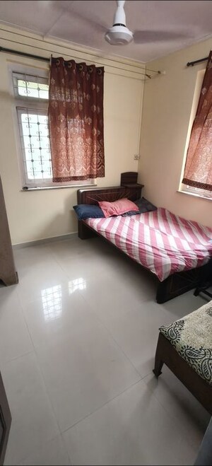 Bedroom in 2 BHK Apartment at Nilanjana CHS, Malad West – for Rent