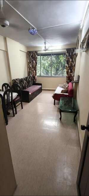 Living Room in 2 BHK Apartment at Nilanjana CHS, Malad West – for Rent