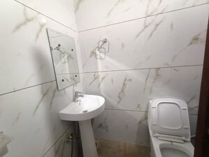 Bathroom in 3 BHK Apartment at Ambience Island Lagoon, Sector 24 – for Rent