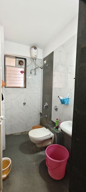 Bathroom in 1 BHK Apartment at Unnati Woods CHS, Kasarvadavali – for Sale