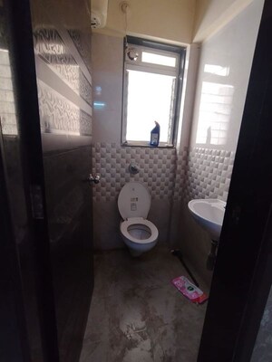 Bathroom in 1 BHK Apartment at Unnati Woods CHS, Kasarvadavali – for Sale