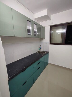 Kitchen in 2 BHK Apartment at Raunak Unnathi Greens, Kasarvadavali – for Rent