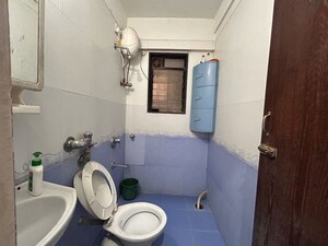 Bathroom in 2 BHK Apartment at Suncity Complex, Powai – for Rent