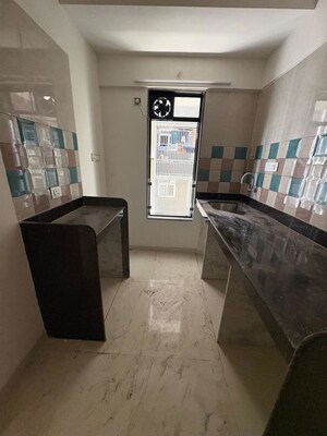 Kitchen in 2 BHK Apartment at Puneet Shivalaya, Tagore Nagar – for Rent