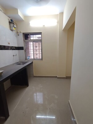 Kitchen in 1 BHK Apartment at Kanchan Pushp Society, Ghodbunder Road – for Sale