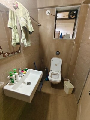 Bathroom in 2 BHK Apartment at Cosmos Jewels, Ghodbunder Road – for Rent