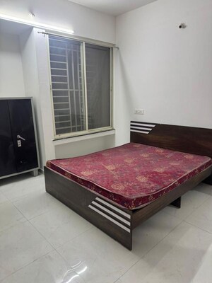 Bedroom in 2 BHK Apartment at Nisarg Akash, Pimple Nilakh – for Rent