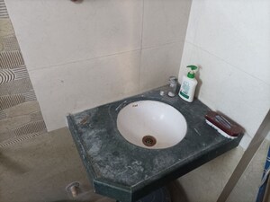 Bathroom in 1 BHK Apartment at Brahmand CHS, Brahmand – for Sale