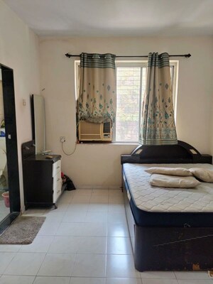 Living Room in 2 BHK Apartment at Dhanlaxmi CHS Mira Road, Mira Road – for Rent