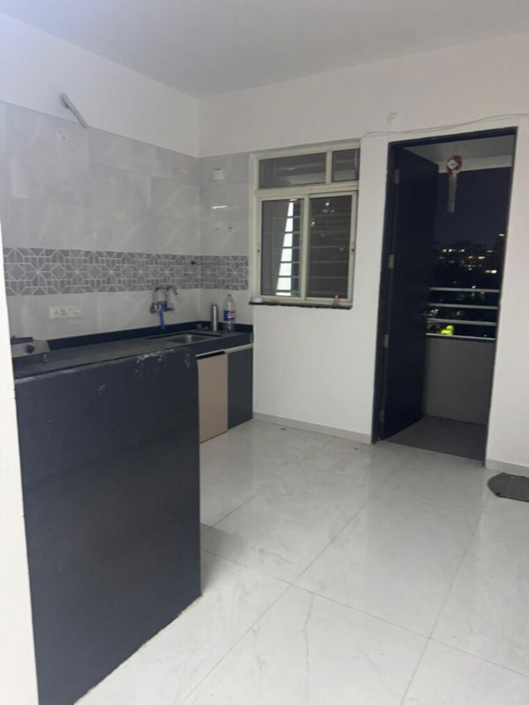 Kitchen, osian-skyra-residency 2 Bedroom 1050 Sq.Ft. Apartment In Balewadi Pune 10228083