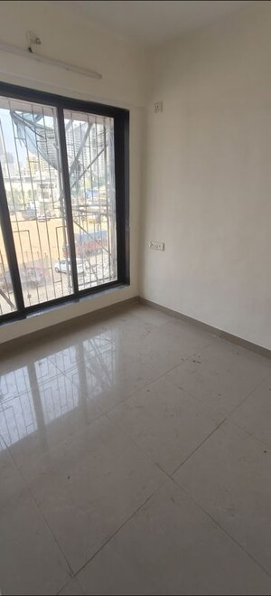 Room in 2 BHK Apartment at Ekta Nagar CHS, Kandivali West – for Rent