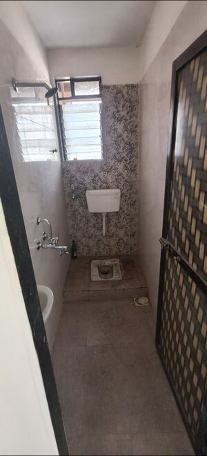 Bathroom in 2 BHK Apartment at Ekta Nagar CHS, Kandivali West – for Rent