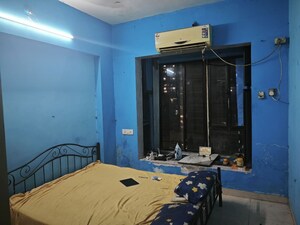 Bedroom in 2 BHK Apartment at Divya Stuti CHS, Goregaon East – for Rent