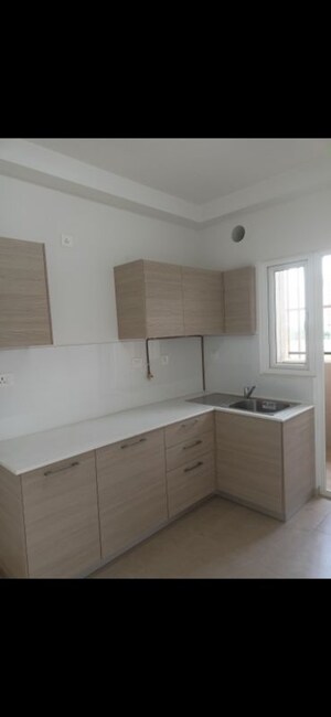 Kitchen in 2 BHK Apartment at Bhartiya City Nikoo Homes II, Thanisandra Main Road – for Rent