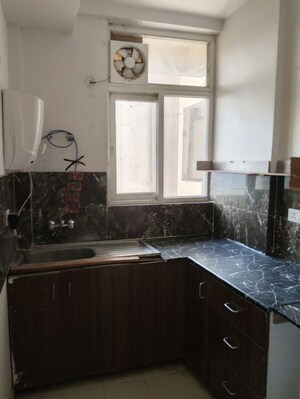 Kitchen in 2 BHK Apartment at Amrapali Riverview, Amrapali Leisure Valley – for Rent