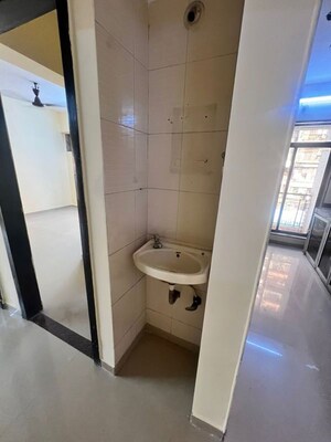 Bathroom in 1 BHK Apartment at Om Sai Aangan Kamothe, Kamothe Sector 34 – for Sale