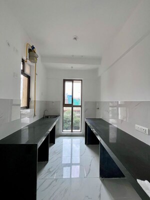 Kitchen in 2 BHK Apartment at Raymond Ten X Habitat, Pokhran Road No Two – for Rent