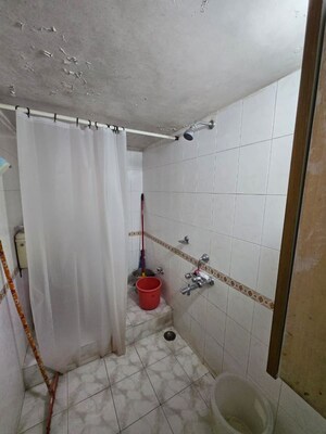 Bathroom in 2 BHK Apartment at Ranade Yashodhan, Mayur Colony – for Rent