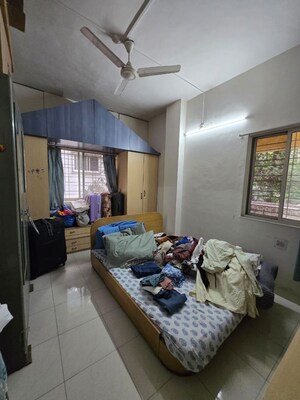 Bedroom in 2 BHK Apartment at Ranade Yashodhan, Mayur Colony – for Rent