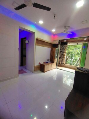 Living Room in 2 BHK Apartment at Mohan Geenwoods, Badlapur West – for Rent