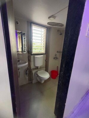 Bathroom in 2 BHK Apartment at Mohan Geenwoods, Badlapur West – for Rent