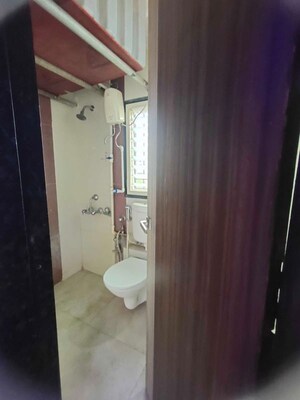 Bathroom in 2 BHK Apartment at Mohan Geenwoods, Badlapur West – for Rent