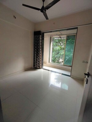Room in 2 BHK Apartment at Mohan Geenwoods, Badlapur West – for Rent