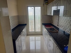 Kitchen in 2 BHK Apartment at Dosti Group Imperia, Manpada – for Rent