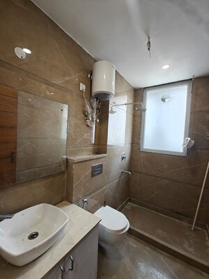 Bathroom in 3 BHK Builder Floor at Ansal Sushant Lok I, Sector 43 – for Rent