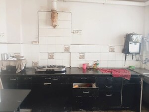 Kitchen in 2 BHK Apartment at Camac Street – for Sale