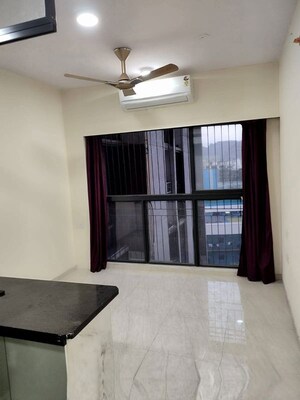Living Room in 1 BHK Apartment at Lodha Crown Quality Homes, Majiwada – for Rent