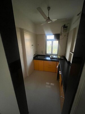 Kitchen in 1 BHK Apartment at Cosmos Classique, Ghodbunder Road – for Sale
