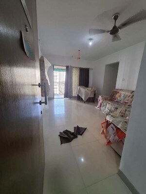 Living Room in 1 BHK Apartment at Athene CHS, Majiwada – for Rent