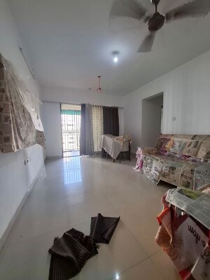 Living Room in 1 BHK Apartment at Athene CHS, Majiwada – for Rent