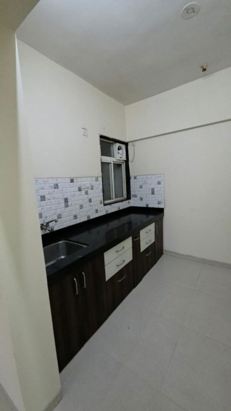 Kitchen, anushree-astral-residency 2 Bedroom 810 Sq.Ft. Apartment In Punawale Pune 10233393