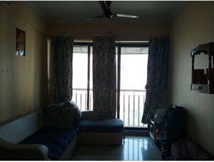 Living Room in 1 BHK Apartment at Coral Heights, Kavesar – for Rent