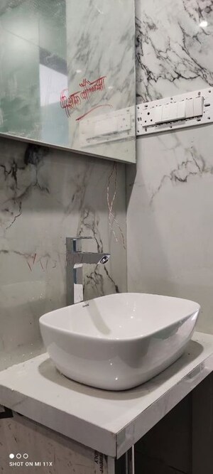 Bathroom in 2 BHK Apartment at Darshan Heights, Charni Road – for Sale