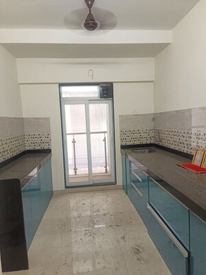 Kitchen in 2 BHK Apartment at Dhamji Shamji Mahavir Spring Tulip Phase 1, Pokhran Road No Two – for Sale