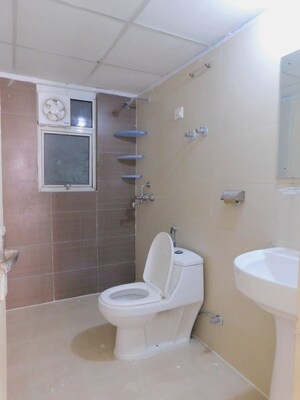 Bathroom in 2 BHK Apartment at Nilaya Greens, Raj Nagar Extension – for Rent