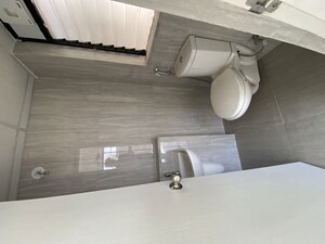 Bathroom in 1.5 BHK Apartment at Runwal Gardens Phase 2, Dombivli East – for Rent