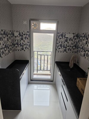 Kitchen in 1 BHK Apartment at Raunak Bliss, Ghodbunder Road – for Rent