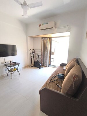 Living Room in 1 BHK Apartment at Manali Building, Malad West – for Rent