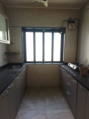 Kitchen in 2 BHK Apartment at Siddhanchal CHS, Pawar Nagar – for Rent