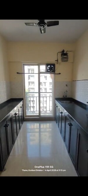 Kitchen in 1 BHK Apartment at Rosa Gardenia, Ghodbunder Road – for Rent