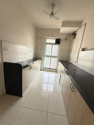 Kitchen in 3 BHK Apartment at Godrej Emerald, Ghodbunder Road – for Rent