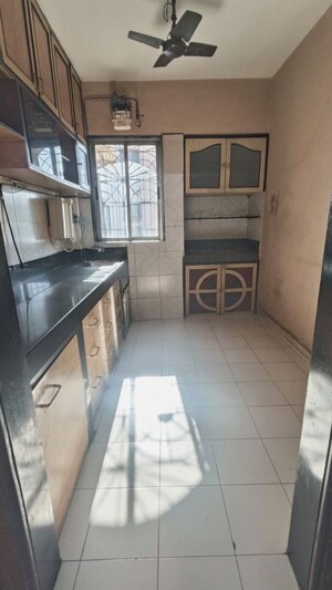 Kitchen in 2 BHK Apartment at Vijay Nagari Annex, Waghbil – for Rent