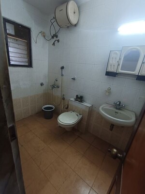 Bathroom in 3 BHK Apartment at Vikas Park CHS, Malad West – for Rent