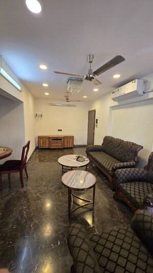 Living Room in 2 BHK Apartment at Manju Tower CHS, Andheri West – for Rent