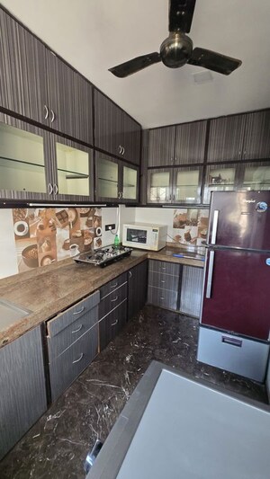 Kitchen in 2 BHK Apartment at Manju Tower CHS, Andheri West – for Rent